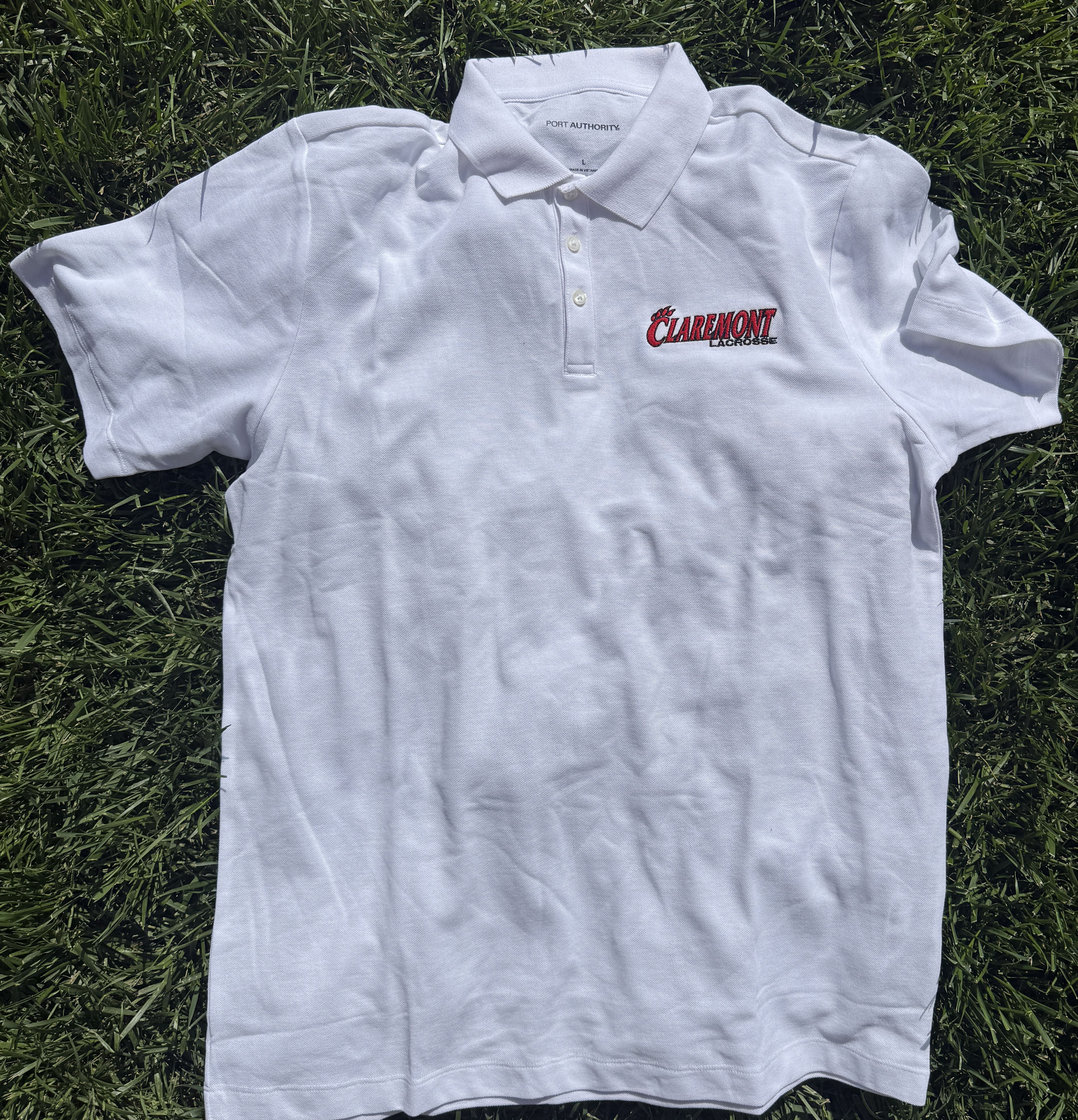 2026 white polo shirt with Claremont Lacrosse logo