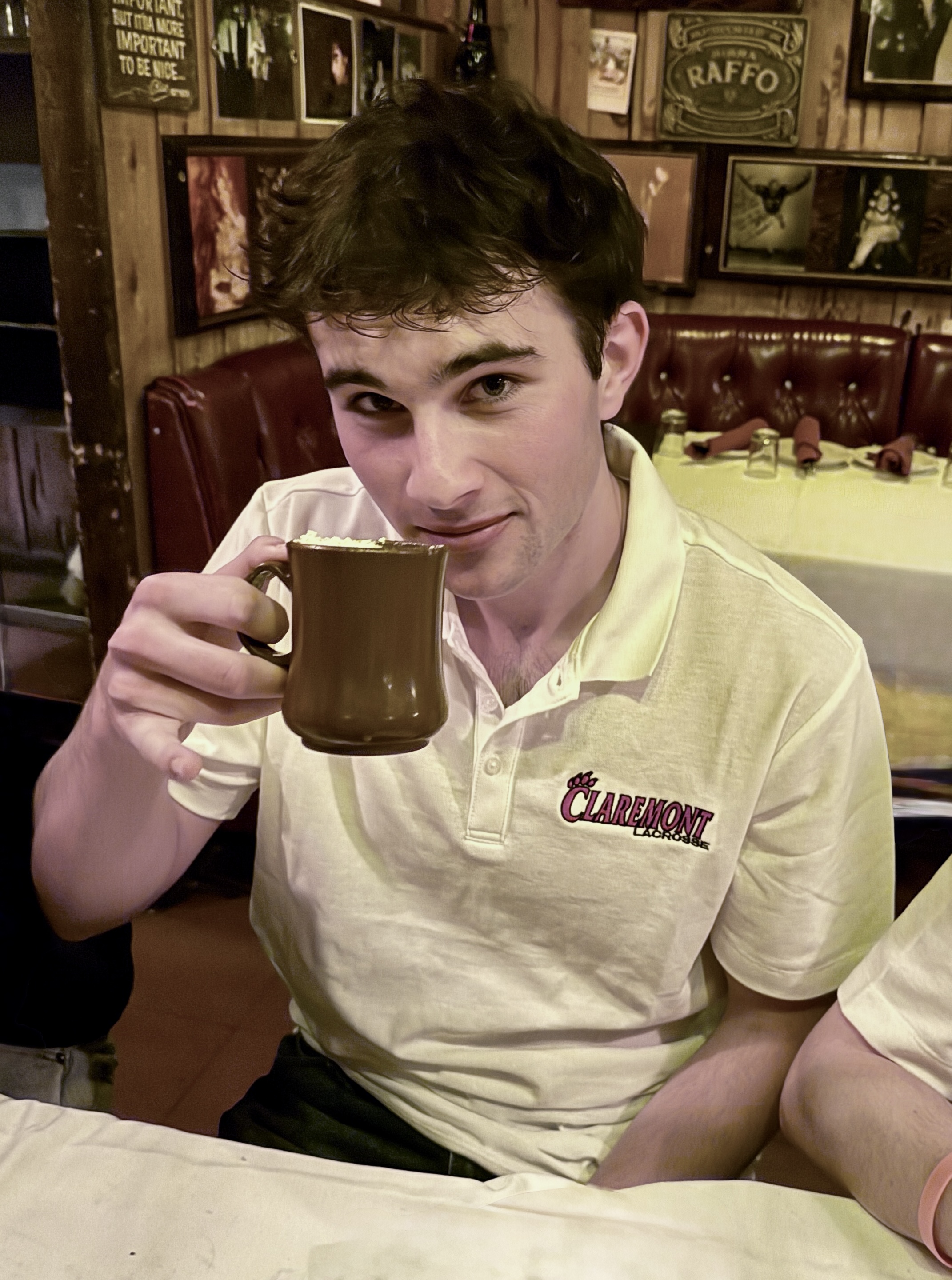 Player wearing white polo shirt